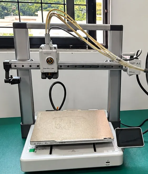 Bambu Lab A1 3D printer with multi-colour filament unit in the lab