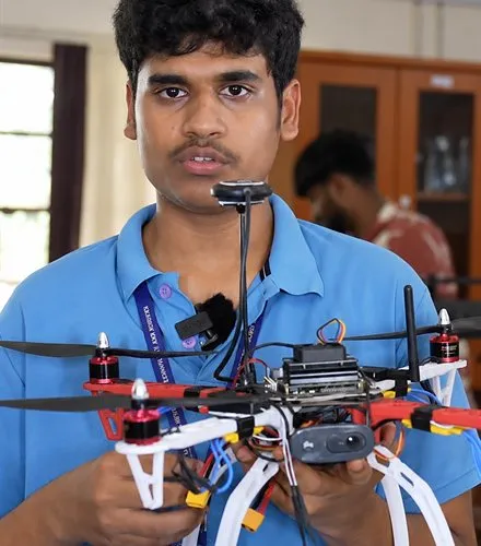 Karunya student demonstrating a multirotor drone he built