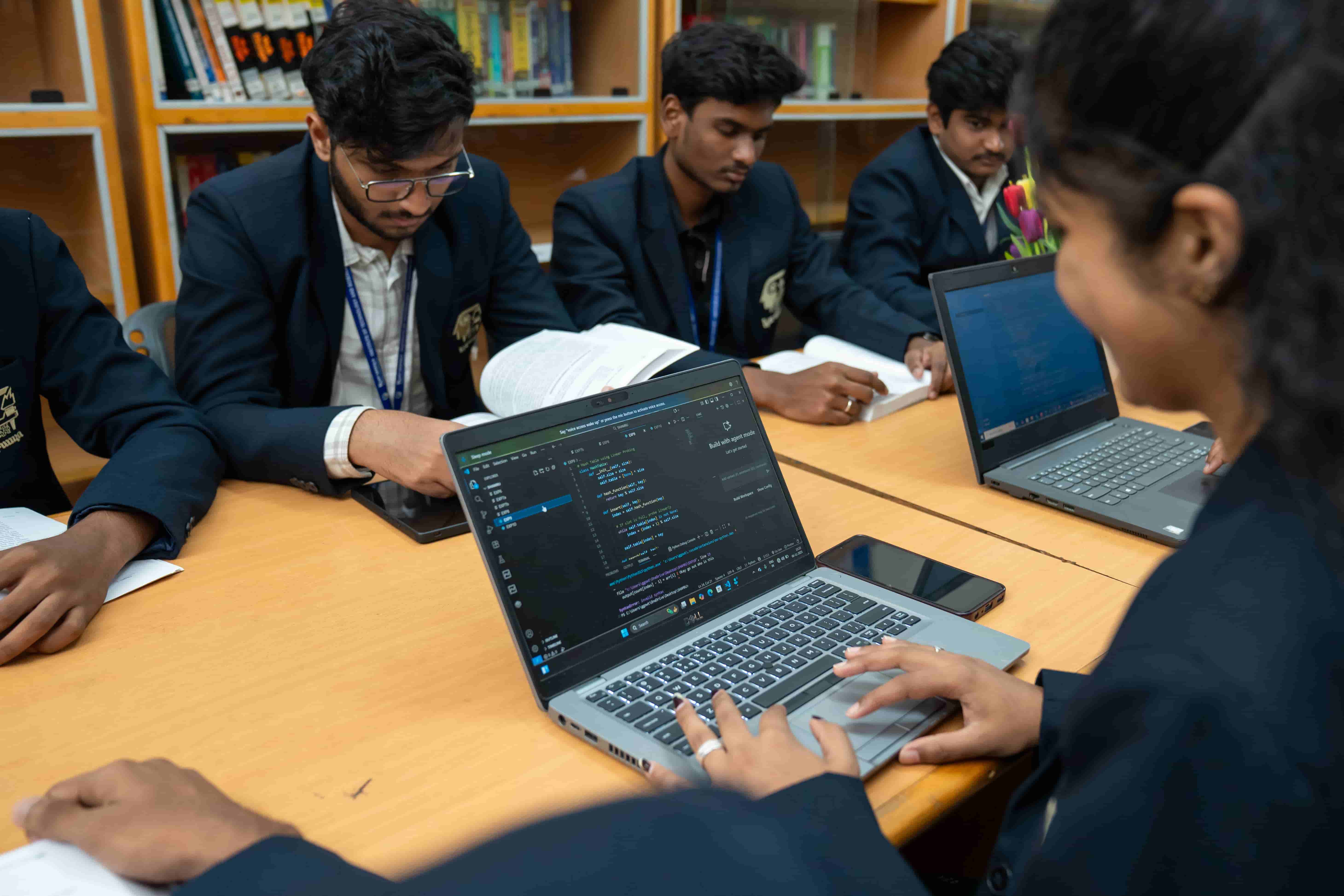 Students working with autonomous robot in AI lab