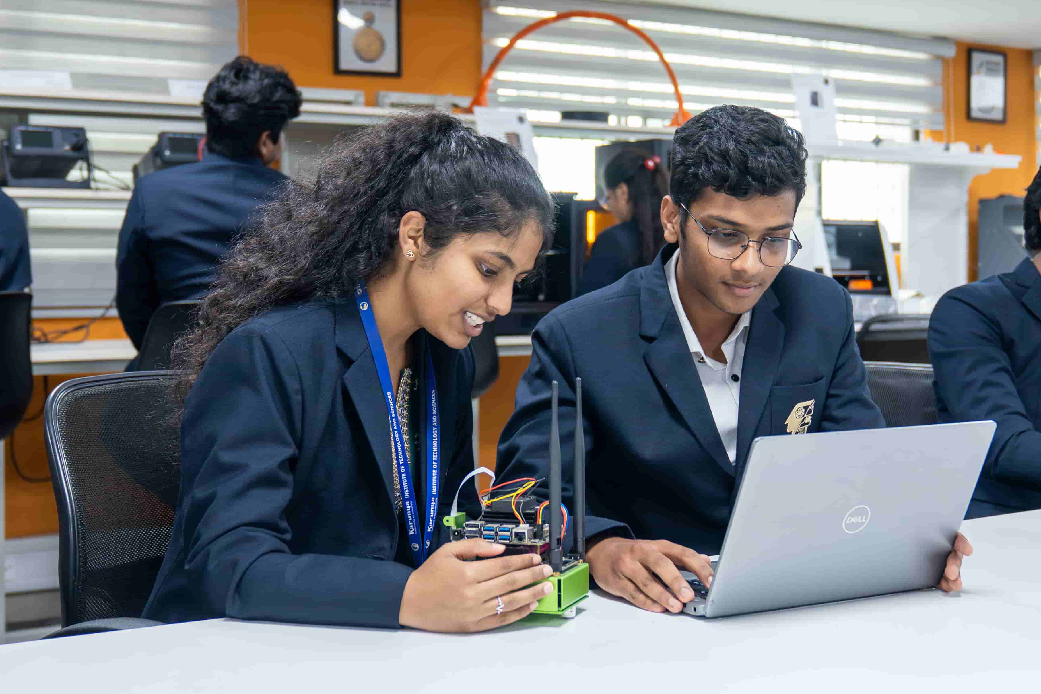 Students working with IoT hardware